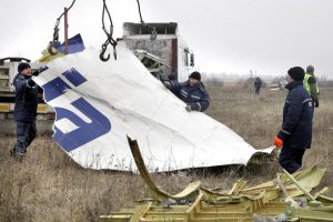 epa04494247 Workers remove parts of the wreckage of Malaysia Airlines passenger jet MH17 at the crash site in rebel-held Grabovo village, about 70 km from Donetsk, Ukraine, 18 November 2014. The Malaysian Airlines plane, which was flying from Amsterdam to Kuala Lumpur, was shot down over Ukraine in July. All 298 people on board were killed. Debris will be transported to the Netherlands for investigation, the Dutch Safety Board said. Access to the site has previously been limited by the rebels, and the ongoing conflict in Ukraine. EPA/ALEXANDER ERMOCHENKO